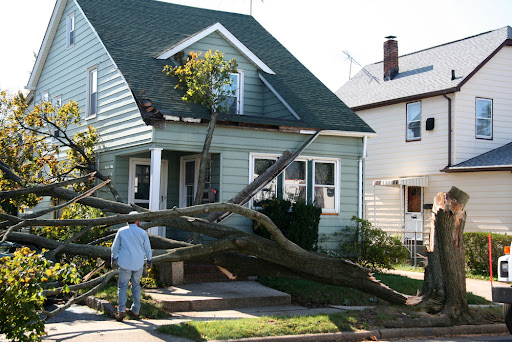 Homeowner looking at roof damage from a storm in Tennessee