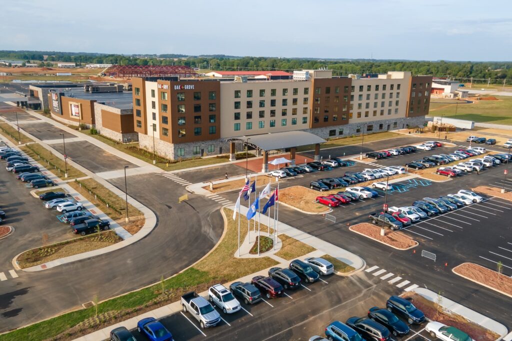 Aerial view of sprawling hotel complex with parking lot. Commercial roofing in Tennessee